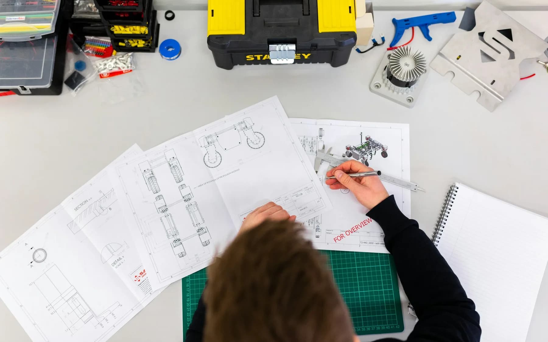 Engineer inspecting industrial equipment during a site review
