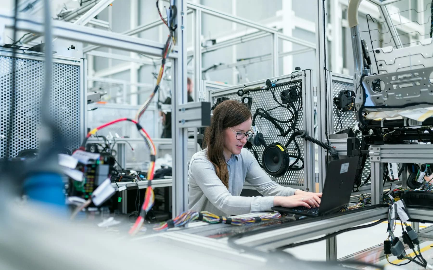 Engineer reviewing technical drawings in an industrial setting